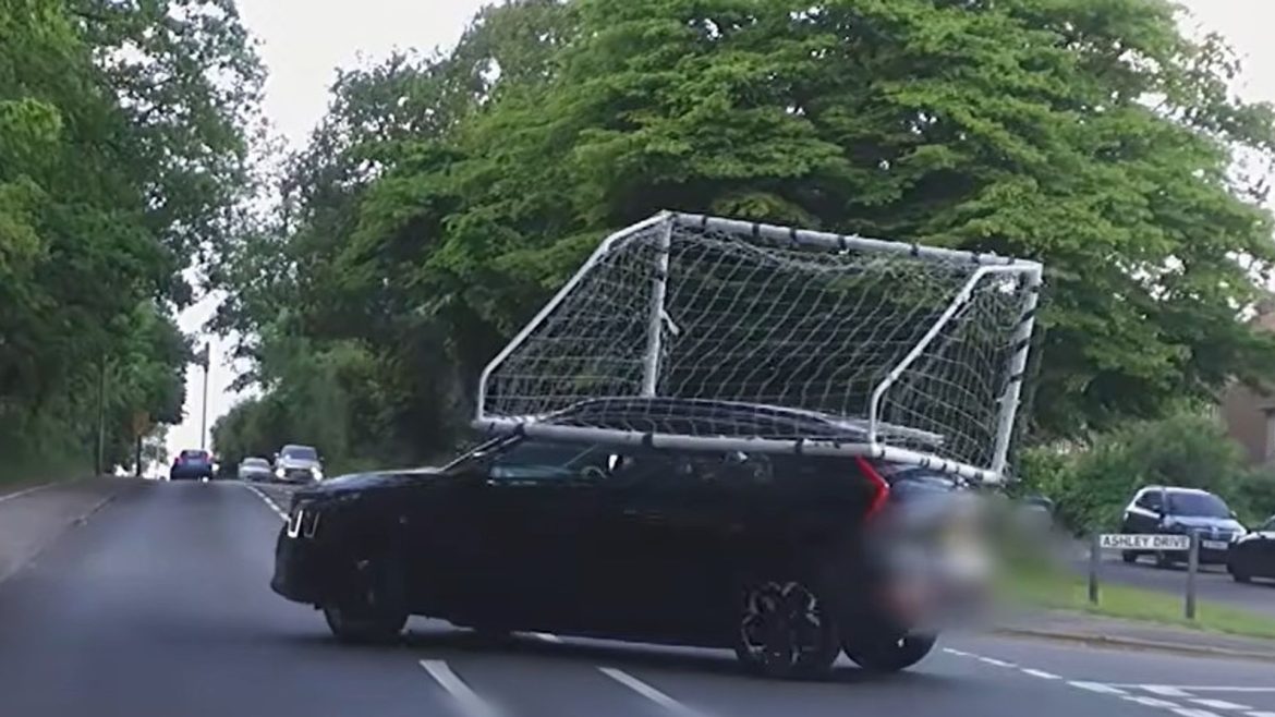 Police share 'own goal' footage of driver with football net on top of car